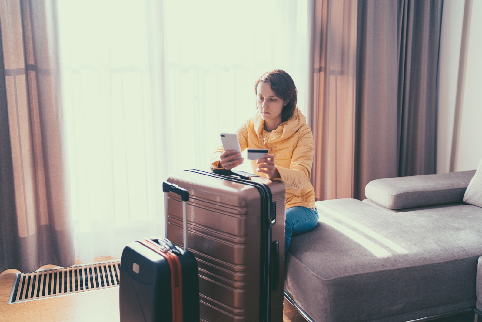 Tourist in hotel room flight reservations