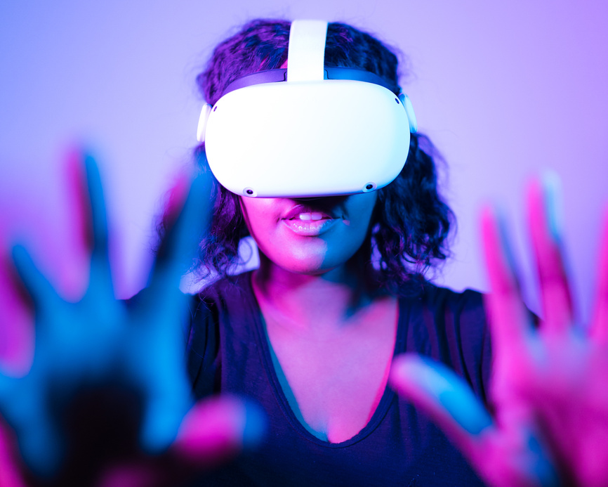 Woman Playing Online Game with VR Headset